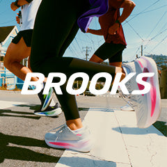 Two people running on a road with 'Brooks' logo overlayed.