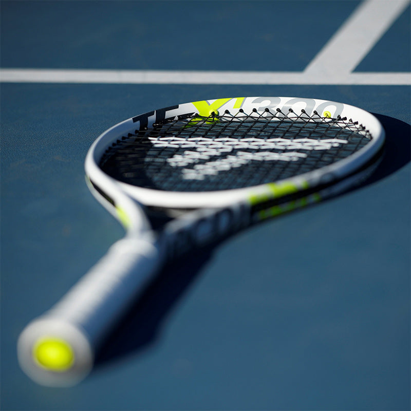 A Tecnifibre TF-X1 300 tennis racquet laying flat on a blue tennis court.