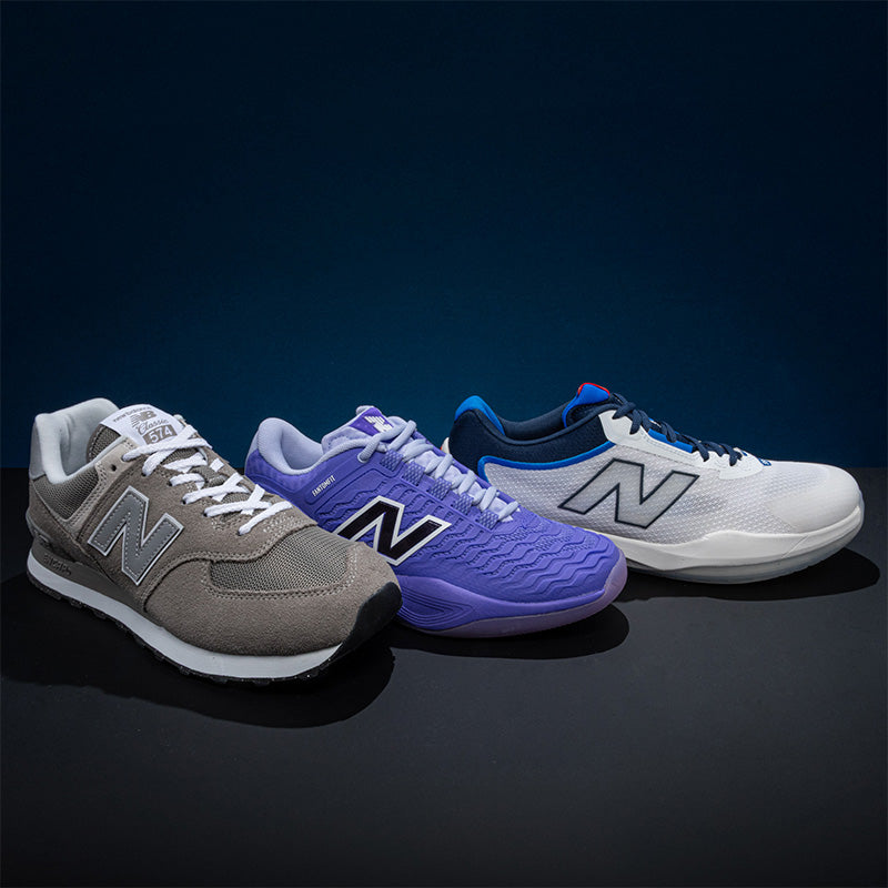 Three New Balance shoes: a gray running shoe, a purple tennis shoe, and a blue and white pickleball shoe on a dark background
