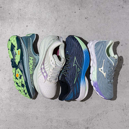 Select HOKA, Saucony, and Mizuno shoes on a gray floor.