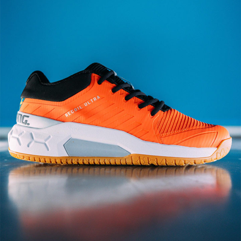 Orange men's Salming Recoil Ultra squash shoes against a blue backdrop