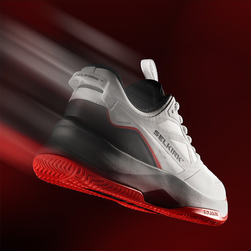 Selkirk CourtStrike Pro 3.0 pickleball shoes with a motion blur effect against a red background