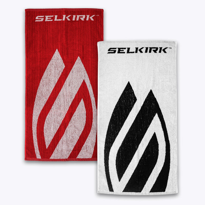 Red and white towels with 'Selkirk' logos shown flat on a white background