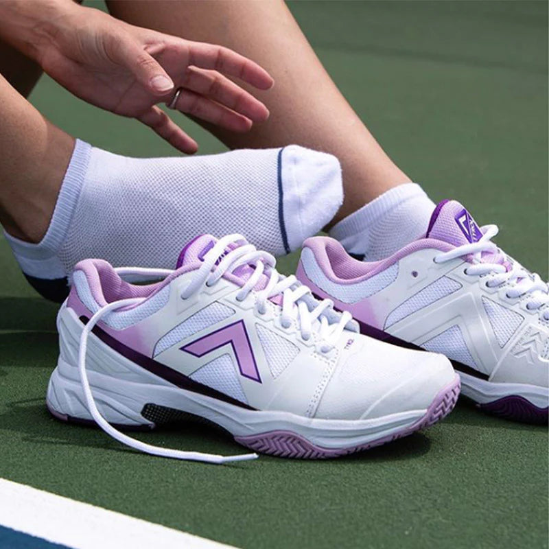 woman about to wear tyrol pickleball shoes