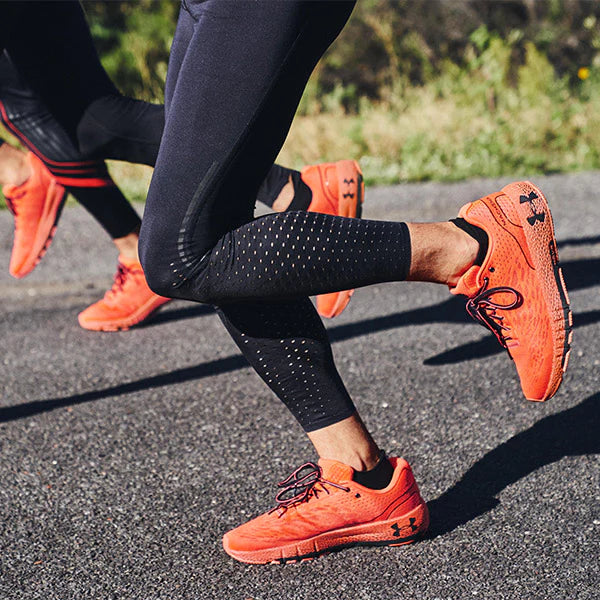 running with orange under armour shoes