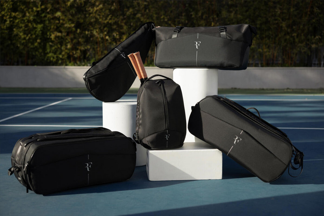 an image showing multiple tennis racquet bags from the Wilson RF collection designed in collaboration with tennis legend Roger Federer.